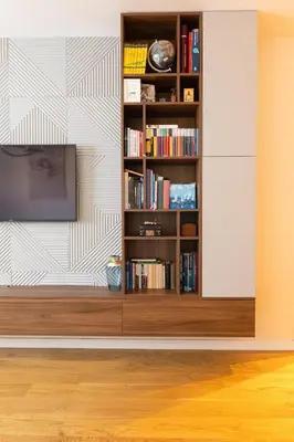 a living room with a book shelf with books at Tramonto City Center Apt with Sea View and Garage in Bar