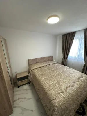 a bedroom with a bed and a window at Ani Sea Lux in Dobra Voda
