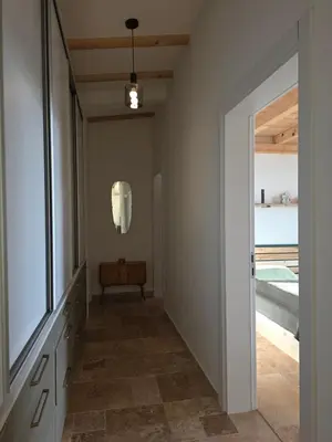 a hallway with a door leading into a house at Sunrise Villa in Bar