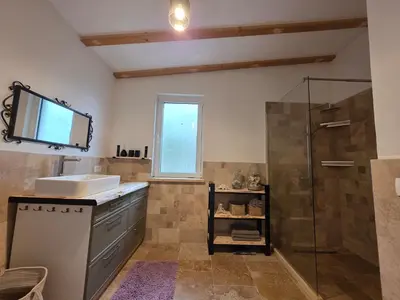 a bathroom with a sink and a shower at Sunrise Villa in Bar