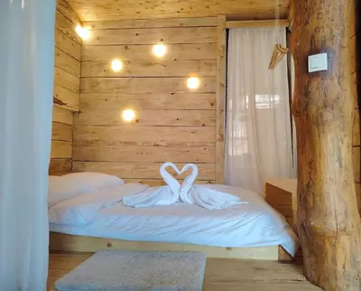 a bedroom with a bed with a swan on it at Hedonizam Lux in Podgorica