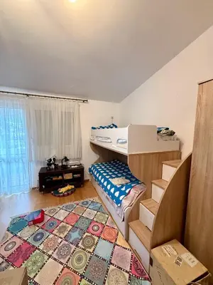a bedroom with a bunk bed and a rug at Sutomore 3-bedroom apartment in Sutomore