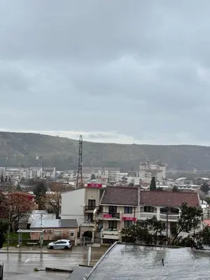 a view of a city with a parking lot and buildings at Sutomore 3-bedroom apartment in Sutomore