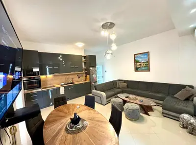a living room with a couch and a table at Bar Lux Two-Bedroom apartment in Bar