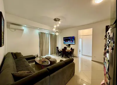 a living room with a couch and a table at Bar Lux Two-Bedroom apartment in Bar