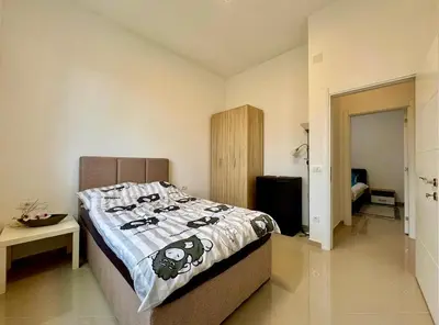 a bedroom with a bed with a hello kitty blanket at Bar Lux Two-Bedroom apartment in Bar