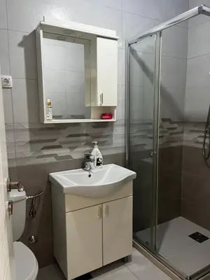a bathroom with a sink and a shower at Sun Stay in Bar