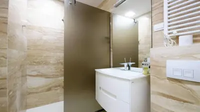 a bathroom with a toilet and a sink and a shower at Vista Deluxe apartment - Tre Canne Budva in Budva
