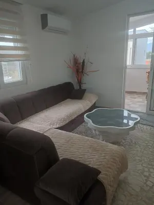 a living room with a couch and a coffee table at Bar ,2 sobni stan ,Namaste ! in Bar