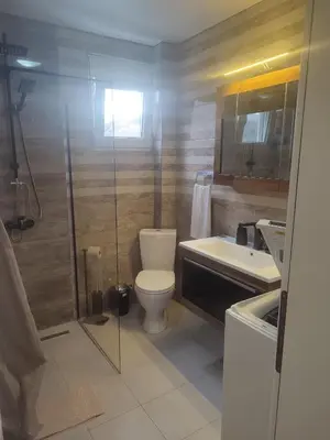 a bathroom with a shower and a toilet and a sink at Bar ,2 sobni stan ,Namaste ! in Bar