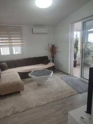 a living room with a couch and a coffee table at Bar ,2 sobni stan ,Namaste ! in Bar