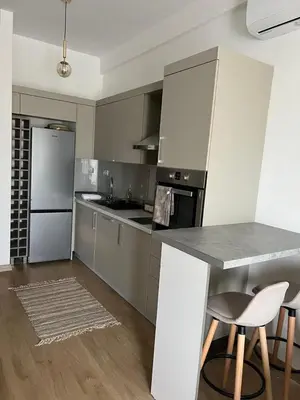 a kitchen with stainless steel appliances and a counter top at Studio UNA - PMTR Building, BAR in Bar