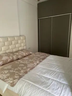 a bedroom with a large bed with a large headboard at Studio UNA - PMTR Building, BAR in Bar