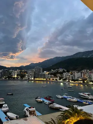 a view of a harbor with boats in the water at Seaview Rafailovici in Rafailovici