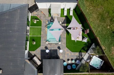 an overhead view of a backyard with a pool and a house at Spa apartment Residence, with 2 pools and jacuzzi in Golubovci