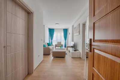 a hallway leading to a living room with a couch at Mir i More in Dobra Voda