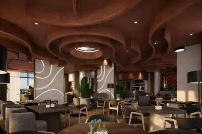 a restaurant with wooden ceilings and tables and chairs at Hotel & SPA Ricardo Residence in Ulcinj