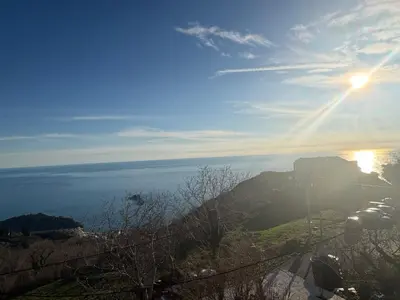 a view of the sun setting over the ocean at Njaro del Mar Zukovica 2 in Žukovica