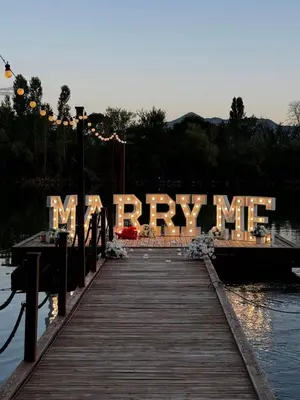 a wooden dock with a sign that reads happymite at Costa Del Rio in Bistrice