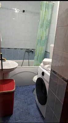 a bathroom with a toilet and a tub and a sink at Apartman Podgorica - Pobrezje in Podgorica