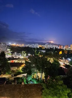a view of a city at night at Apartman Podgorica - Pobrezje in Podgorica