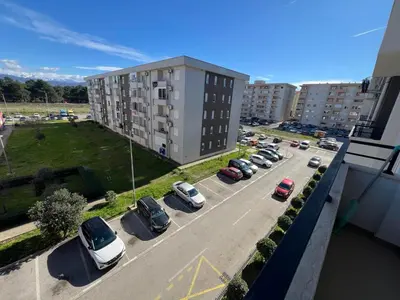 an aerial view of a parking lot with cars parked at Royal Stay Podgorica - Princess Apartment in Podgorica