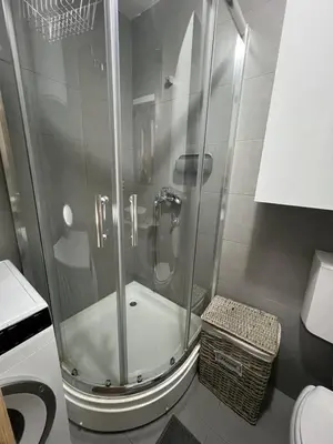 a shower with a glass door in a bathroom at Royal Stay Podgorica - Princess Apartment in Podgorica