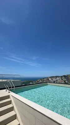 a swimming pool on top of a building at Etihad Apartments&Spa in Ulcinj