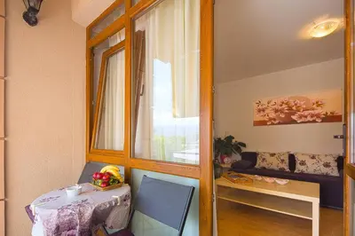 a small room with a table and a window at Apartment Srdanovic in Budva