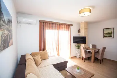 a living room with a couch and a table at Apartments Bogojevic in Ulcinj