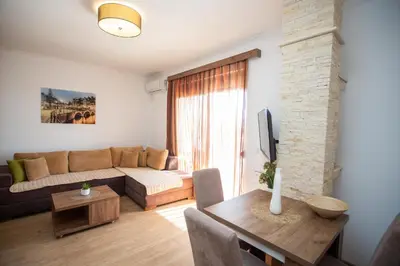 a living room with a couch and a table at Apartments Bogojevic in Ulcinj
