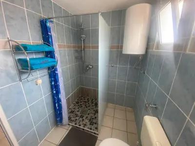 a bathroom with a shower with a toilet at Apartments Sunpoint in Ulcinj