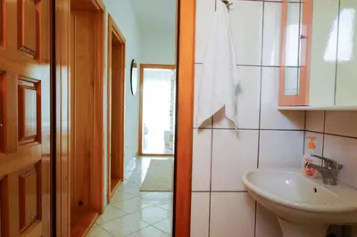 a bathroom with a sink and a toilet at Guest House Heart of Budva in Budva