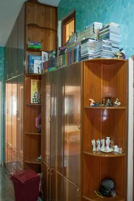 a wooden book shelf with books on top of it at Apartment Mira in Budva