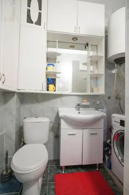 a bathroom with a white toilet and a sink at Apartment Mira in Budva