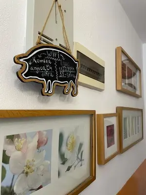 a sign is hanging on a wall with pictures at Apartment Mira in Sutomore