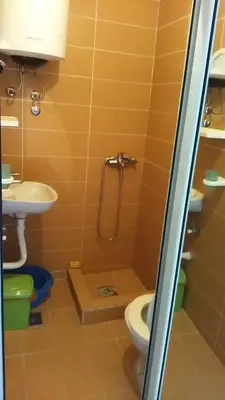 a bathroom with a toilet and a sink at Apartment Mira in Sutomore