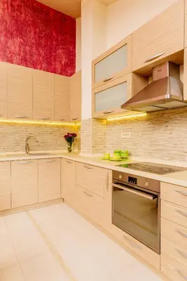 a kitchen with wooden cabinets and a sink at Kotor Luxury View in Kotor