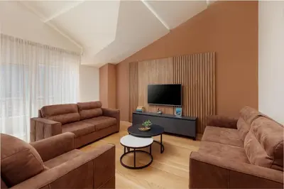 a living room with two couches and a tv at Kotor Luxury View in Kotor