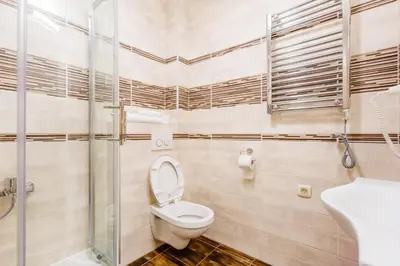 a bathroom with a toilet and a shower and a sink at Kotor Luxury View in Kotor