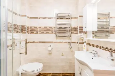 a white bathroom with a toilet and a sink at Kotor Luxury View in Kotor
