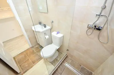 a bathroom with a toilet and a shower at Bay View Apartments in Kotor