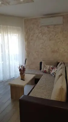 a living room with a couch and a table at Apartment Dragan in Budva