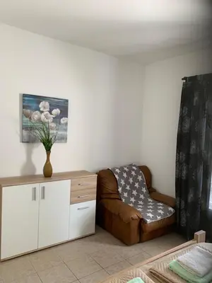 a living room with a couch and a chair at Apartments Ljiljana in Bar