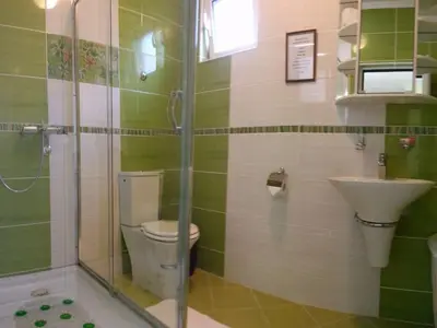a bathroom with a toilet and a sink at Apartment Sofia in Sutomore