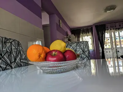 a bowl of fruit sitting on a table at Apartment Branka in Budva