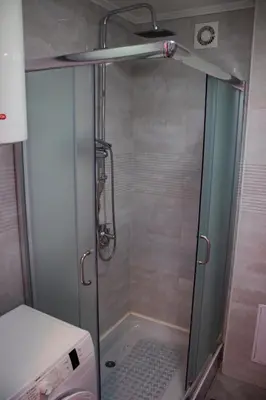 a shower with a glass door in a bathroom at Apartment Branka in Budva