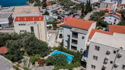 an aerial view of a city with buildings at Apartments My Przno in Sveti Stefan