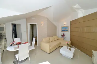 a living room with a couch and a table at Sunshine of Montenegro - Family Oasis in Kotor