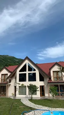a large house with a red roof at Villa Coast of Montenegro in Bar